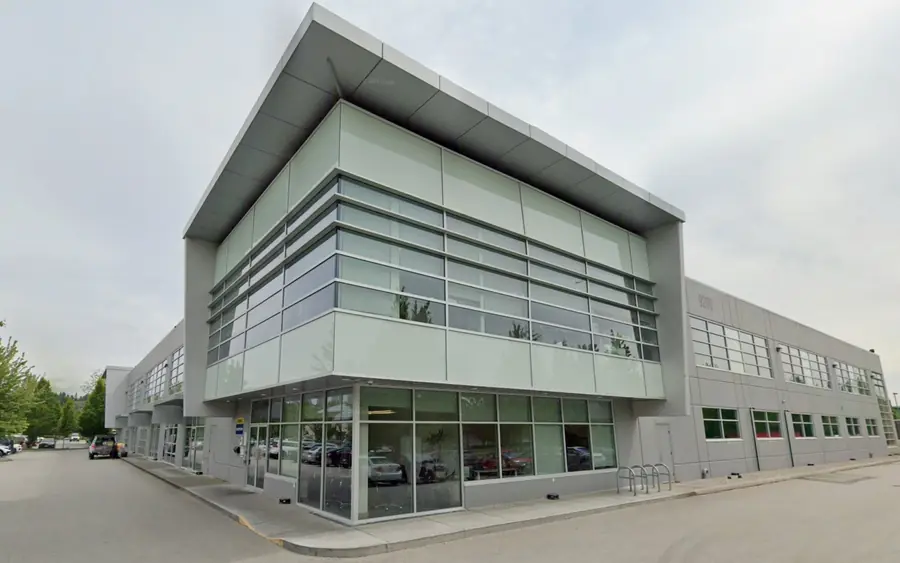 Exterior of a modern manufacturing facility with glazed offices in Burnaby, British Columbia.
